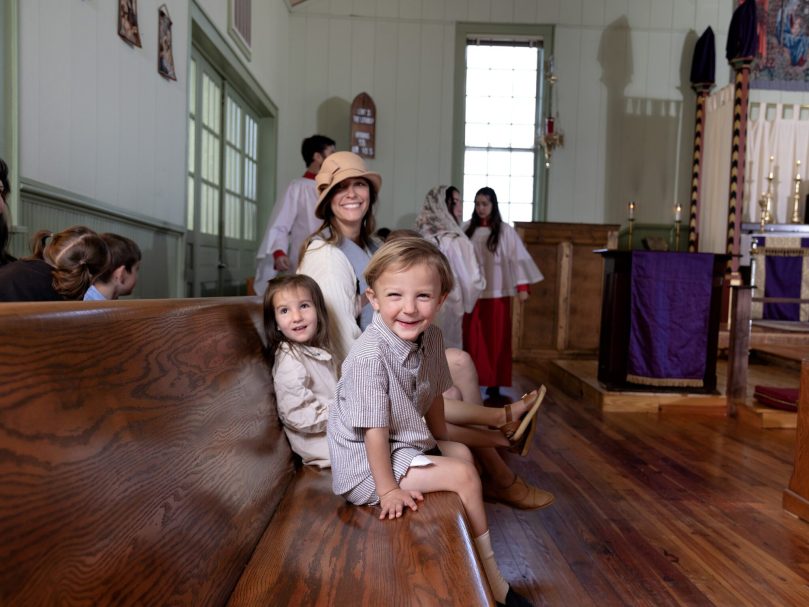 Father Gregory Tipton’s family is photographed before the sung Sunday Mass at St. Aelred Church. Leo, front, Maria, back left, Megan and Becket Tipton back center. The church is a parish of The Personal Ordinariate of the Chair of Saint Peter.   The purpose of the ordinariate is to provide Anglicans a path to become Roman Catholic. Photo by Johnathon Kelso