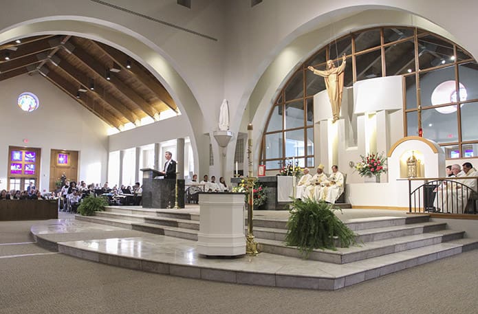 Phil Barreca, the director of music at St. Andrew Church, Roswell, leads the congregation during the singing of the responsorial psalm. Archbishop Wilton D. Gregory was the main celebrant and homilist for an Aug. 27 Mass marking the renovation of St. Andrew Churchâs 28-year-old structure. Photo By Michael Alexander