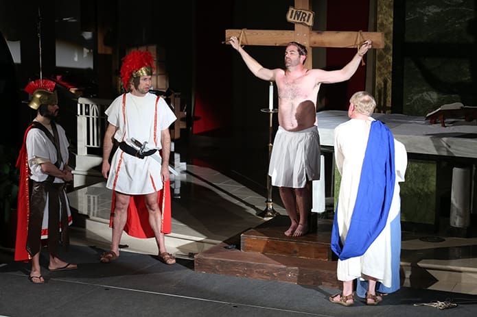 John, the disciple of Jesus (Larry Moyer) and Mary, the Mother of Jesus (Martha Collins), right,  look upon the crucified corpus of Jesus as the soldiers look on from the left. Photo By Michael Alexander