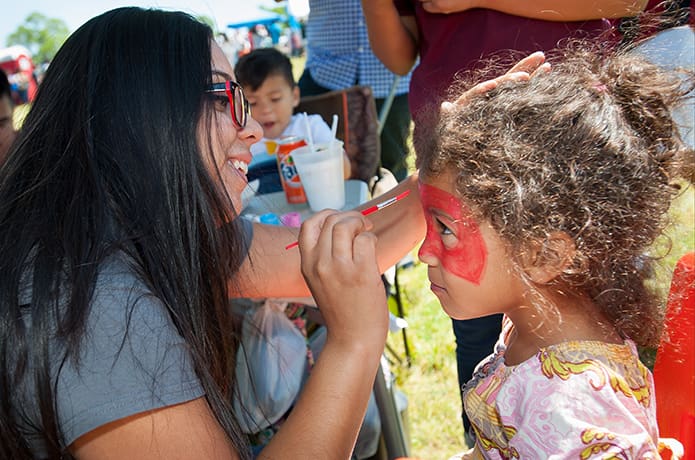 A little girl gets her face painted during the festivities that surrounded the groundbreaking celebration. Photo By Gibbs Frazeur