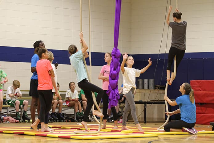 Members of the Spanish web act prepare to practice during the 8 oâclock hour on Sept. 16. Photo By Michael Alexander