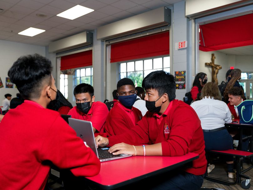 Students congregate at St. Mary's Academy before classes begin on the first day of school. Photo by Johnathon Kelso