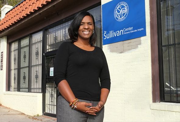 Serene Coleman stands in front of the Sullivan Family Support Center in southwest Atlanta, where she serves as director of client service for St. Vincent de Paul Georgia. Photo By Michael Alexander