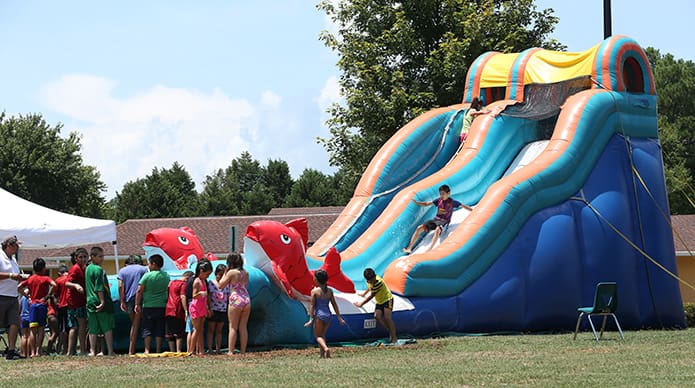 The Big Kahuna water slide was a cool diversion for the youngsters on a hot day with temperatures in the mid 90s. Photo By Michael Alexander