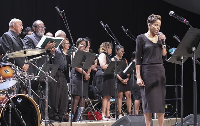 Under the direction of Robby Glade, the choir from Sts. Peter and Paul Church, Decatur, provides the music for the Eucharistic Congress closing Mass. Photo By Michael Alexander