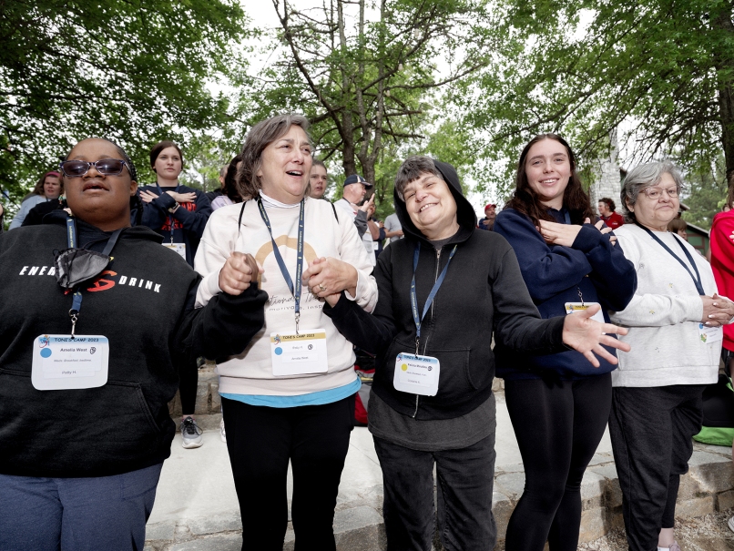 Felicia Miralles, center,  holds hands with fellow campers and counselors at Toni's Camp held in Rutledge. The camp is named for her late mother. Photo by Johnathon Kelso.