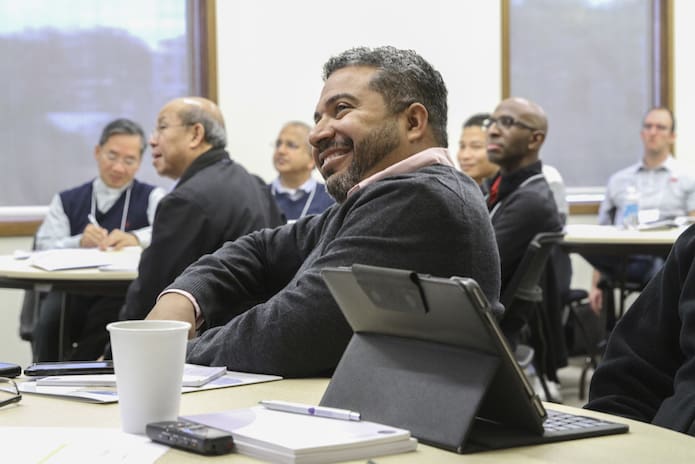 Father Benny Prado, foreground, administrator of St. Teresa of Calcutta Church, Mountclair, N.J., learns about inheriting a parish in crisis. At the table immediately behind him are five of the 10 Archdiocese of Atlanta priests participating in the Nov. 14 Toolbox for Pastoral Management session. Photo By Michael Alexander