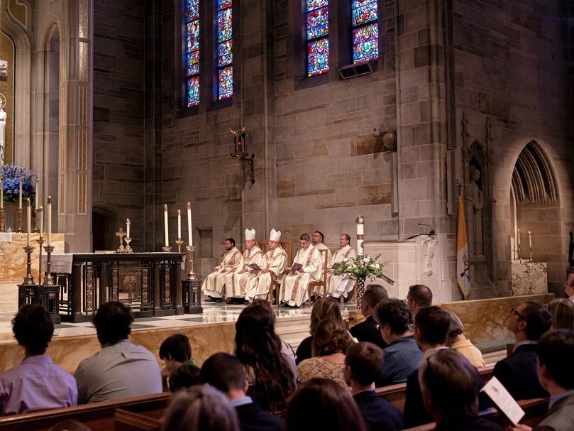 Clergy members listen to the first reading during the Rite of Ordination to the transitional diaconate held at the Cathedral of Christ the King May 21. Photo by Johnathon Kelso