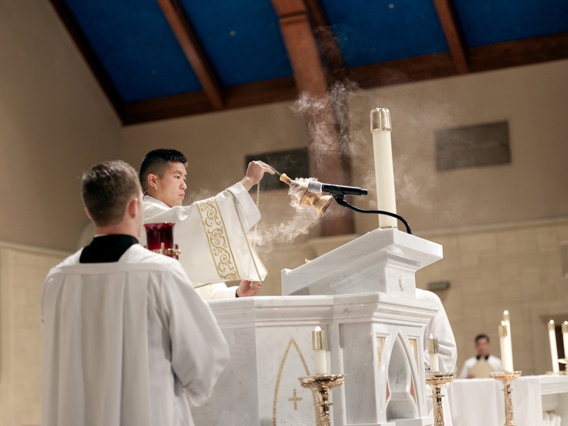 Deacon Nicholas Le censes the ambo before the Gospel reading during the Mass of ordination to the transitional diaconate at St. Peter Chanel Church,  Roswell, May 20. Photo by Johnathon Kelso