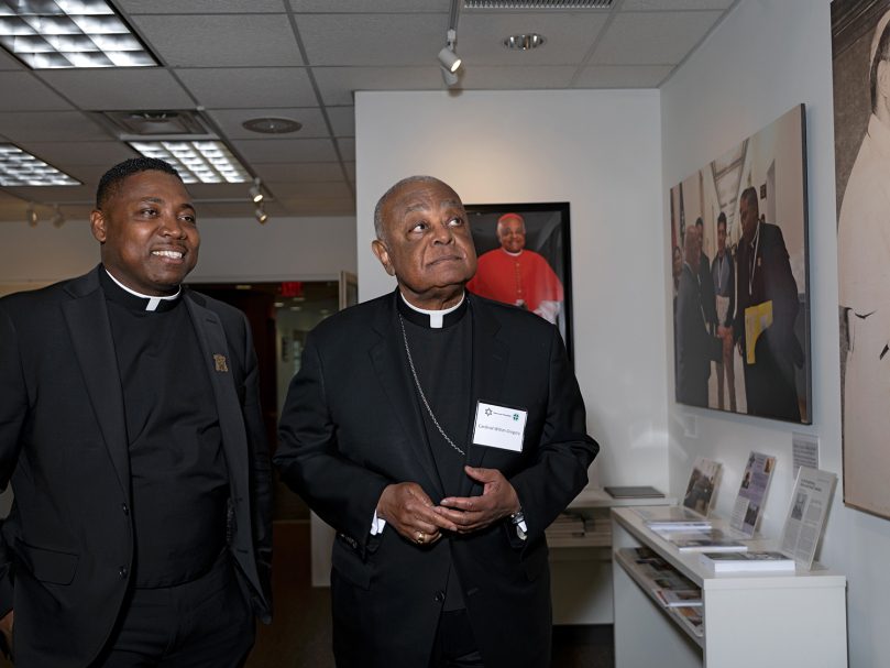 Cardinal Wilton Gregory of Washington, right, tours the Lyke House Gallery with Chaplain, Father Urey Mark. The gallery highlights the contributions of the Black community to the Catholic Church. Photo by Johnathon Kelso