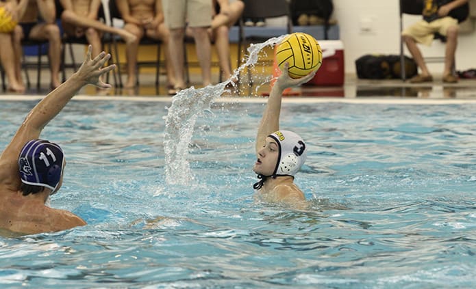 In this instance St. Pius’ Perry Brandes (#3) is looking for a teammate to pass the ball to, but he also scored three goals in the team’s 15-14 loss to defending state champions, Norcross, in the Oct. 12 semi-final match of the Georgia High School Water Polo Association (GHSWPA) state championship at the Cumming Aquatic Center. Photo By Michael Alexander