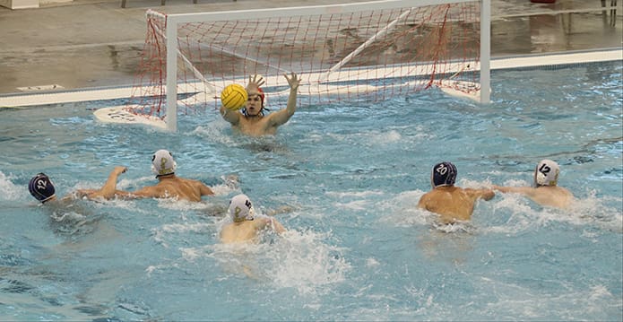 St. Pius sophomore goalie Andres Garcia makes a save during the second half of the semi-final match against Norcross. Photo By Michael Alexander