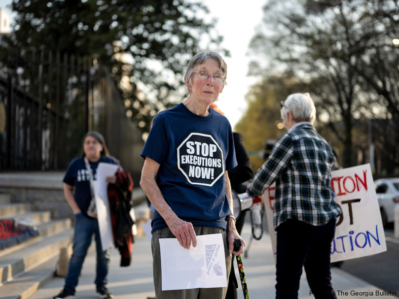 Mary Sinclair participated in a prayer vigil outside the Georgia State Capitol building on the evening of the execution of Willie James Pye. Photo by Johnathon Kelso