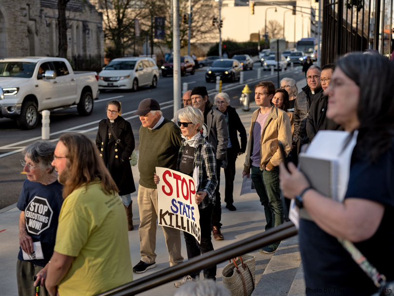 Vigil participants gather on the steps of the Georgia State Capitol building on the evening of the execution of Willie Pye. It was Georgia's first execution in four years. Photo by Johnathon Kelso