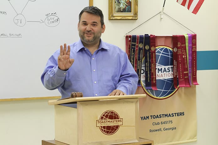 Adolfo Ponce de Leon, who served as the âahâ and âumâ counter during the speeches, gives his report during the YAM Toastmasters Clubâs May 22 meeting. The club meets every 1st, 2nd, and 3rd Thursday of each month. Photo By Michael Alexander