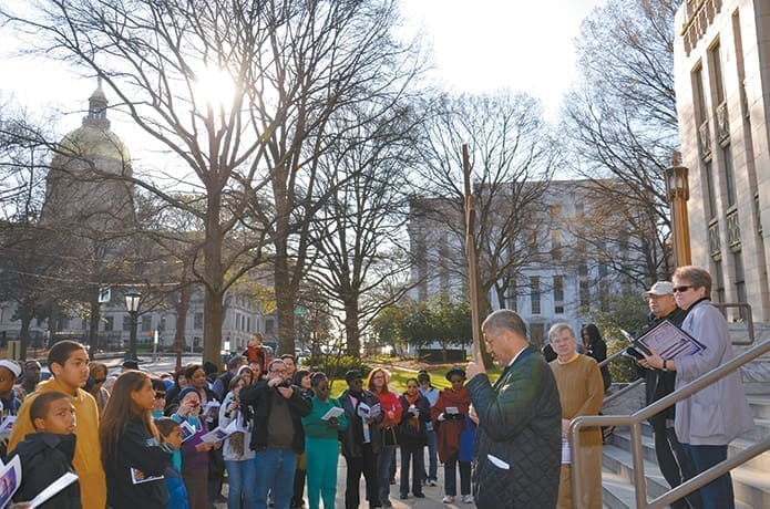 The 33rd annual Good Friday Pilgrimage was held March 29, with a large group of people of all faiths gathering to remember in a public way the crucifixion of Jesus Christ within the urban setting of Atlanta.