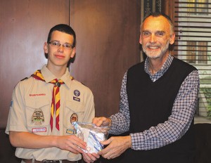 Matthew Hill, left, organized the making of 500 hygiene kits that were given to the people who are homeless served by the Shrine of the Immaculate Conception, Atlanta. Deacon Bill Payne, right, met with him to identify the items the Shrine’s ministry needed.