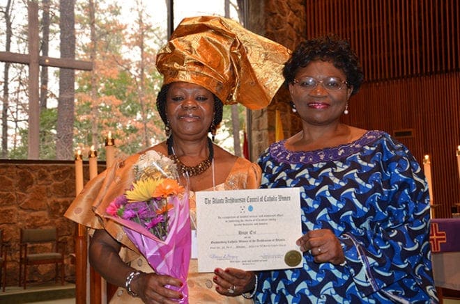 Hope Eze, left, is the honoree from Christ Our Hope Church, Lithonia, at the Feb. 23 Mass. She is shown with Florence Okafor.