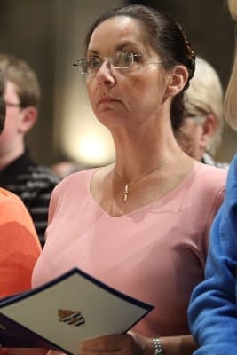 Amy Talley of Columbus, Ga., the sister of Bishop-designate David Talley, attends the solemn vespers service at the Cathedral of Christ the King, Atlanta, April 1.