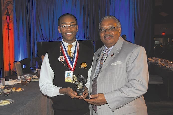 Brandon Fountain, left, received an award from the 100 Black Men of American organization. He is with DeKalb County’s Cornelius Stafford, the 2013 mentor of the year. It was the first time both mentor and mentee from the DeKalb County chapter received this recognition.