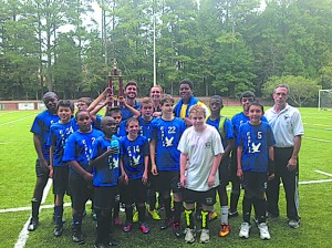 The Sophia Academy Eagles gather around their first place trophy. They include (l-r, front row) Michael Greyer, Trey Butts, Robert Lipscomb, James Kilpatrick, Christopher Wasson, Trey Middleton, Mac DeBalsi, Matthew Miramontes and head coach John Turner; (l-r, middle row) Miro Libelt, Nick Walsh and Jack Dillard; (l-r, back row) Josue Blocus, Eric Vogel, assistant coaches Tim Kennedy and Hillary Braxton and Keenan Tinsley.