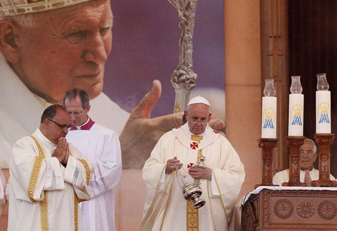 Pope Francis celebrates Mass at Amman International Stadium in Jordan May 24.