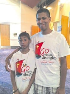 Ryan McKenley, right, a member of Corpus Christi Church, Stone Mountain, said the theme of discipleship means Jesus wants teens to call more people to follow him. Photo By Katie Buckis