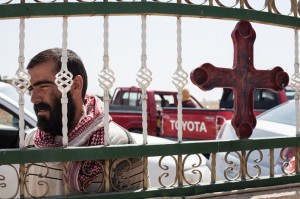 A Yazidi refugee awaits for his turn at a distribution event organized by CRS and Caritas Iraq at the Church of Apostles in Fishkhabour, Iraq . ©Photo by Hare Khalid/Metrography for Catholic Relief Services 