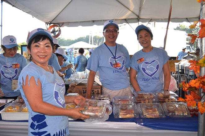 Food vendors offer their wares—traditional Vietnamese food—at the Fall Festival sponsored by Holy Vietnamese Martyrs Church in Norcross. Each Labor Day weekend the festival draws Vietnamese Catholics from around the Southeast. An estimated 40,000 attended the event this year. PHOTO BY CINDY CONNELL PALMER