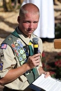 Boy Scout Shawn Matthews, a Life Scout with Troop 422, takes part in the dedication of a rosary garden at his parish, St. Catherine of Siena, in Kennesaw, Oct. 5. He drew up the plans and organized construction of the garden as a place of prayer and learning the rosary. The garden was his project to earn the rank of Eagle Scout.