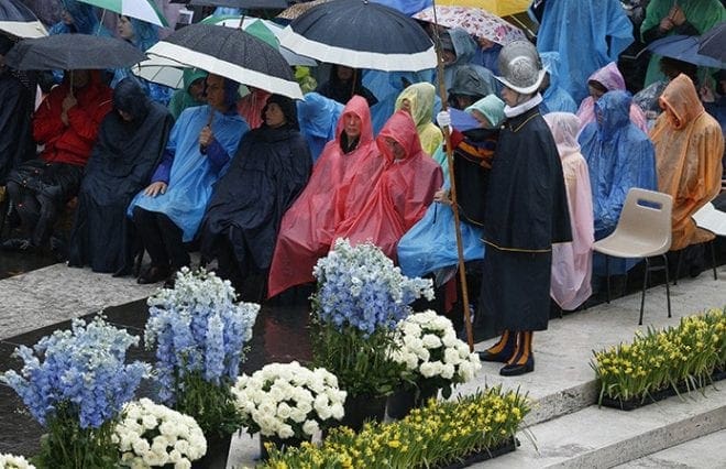 The faithful attend Easter Mass celebrated by Pope Francis in St. Peter's Square at the Vatican April 5.CNS photo/Paul Haring