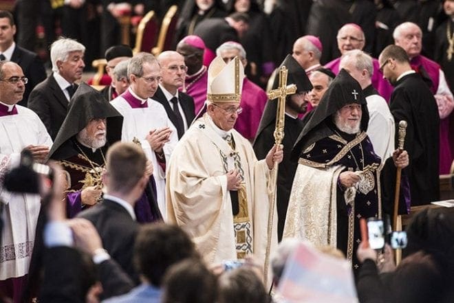 Pope Francis is flanked by Catholicos Aram of Cilicia, Lebanon, left, and Catholicos Karekin II of Etchmiadzin, patriarch of the Armenian Apostolic Church, as he leaves after celebrating an April 12 Mass in St. Peter's Basilica at the Vatican to mark the 100th anniversary of the Armenian genocide. CNS photo/Cristian Gennari 