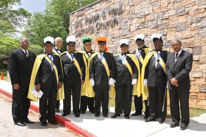 Knights of Peter Claver, Sts. Peter and Paul Council 313 members on hand for the 25th anniversary Mass included (l-r) Kenneth Lewis, Robert Carter, Willie Gude, district secretary; Roderick Jones, recording secretary; Thomas Grant, area deputy; Stanmore Hinds, grand knight and faithful captain; Michael Coleman, Lee Robinson, Fred Maxwell, financial secretary; and Ed Honoré. Photo By Michael Alexander