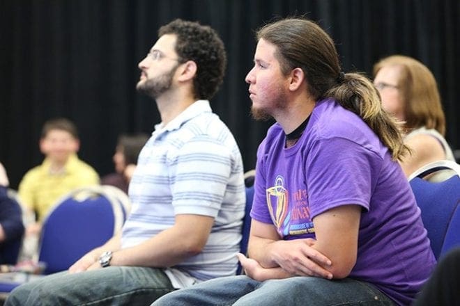 Juan Posada, left, from Church of the Transfiguration, Marietta, and Hugo Soto from St. John Neumann Church, Lilburn, take part in the American Sign Language track. Photo By Michael Alexander