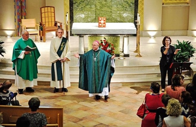 A Mass to commemorate the 25th anniversary of the Americans With Disabilities Act was celebrated July 26 at St. Ann Church, Marietta. Shown (l-r) are: La Salette Father John Gabriel, Deacon Nicholas Morning, Bishop David P. Talley and Kathy Daykin, director of deaf services for the Atlanta Archdiocese. Photo by Lee Depkin