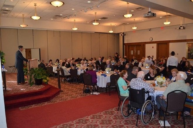 Mark Christopher, chairman of the board of directors for the Catholic Foundation of North Georgia, addresses the Deo Gratias Society members at the luncheon. He reported that the foundation’s assets have grown to $52 million, allowing for grants last year to nearly 180 organizations totaling $1.5 million. Photo By Cindy Connell Palmer