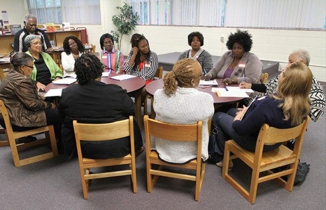 Black Catholics from various parishes around the Atlanta Archdiocese dialogue with each other and take notes as they split off into several small breakout groups. The black Catholic clergy of Atlanta and the Office for Black Catholic Ministry sponsored the Faith in Action event. Photo By Michael Alexander