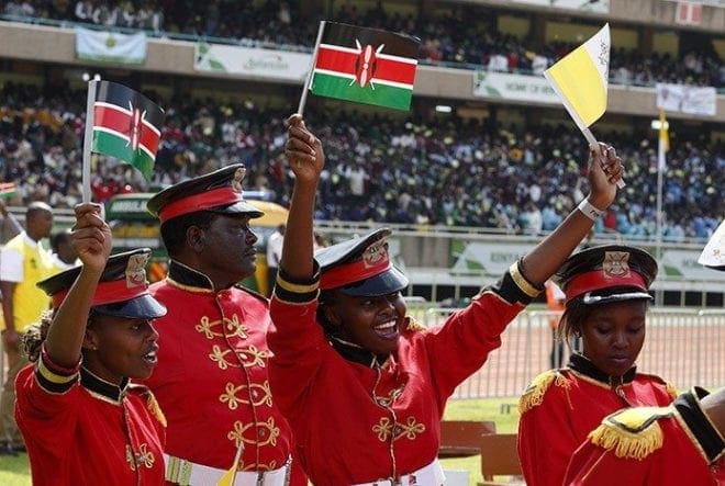 Band members wave Kenyan and Vatican flags before Pope Francis' meeting with youths at Kasarani Stadium in Nairobi, Kenya, Nov. 27. CNS photo/Paul Haring
