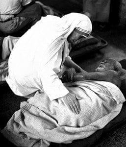 Pope Francis has approved a miracle attributed to the intercession of Blessed Teresa of Kolkata, thus paving the way for her canonization. She is pictured with an ailing man in an undated photo. 