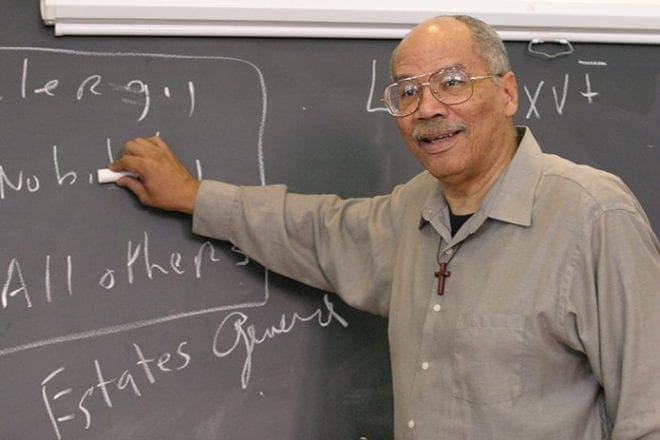 Father Giles Conwill goes over some material with his World History students as he preps them for an upcoming test. Father Conwill holds a Ph.D. in history and cultural anthropology from Emory University, Atlanta. He currently chairs the history department at Morehouse College, Atlanta, where he has been a professor since 1987. Father Conwill, a native of Louisville, Ky., was ordained a priest for the Diocese of San Diego, Calif., in 1973. Photo By Michael Alexander