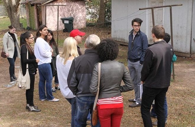 A group of eight University of Georgia students and a family of three prepare to drive over to the Stewart Detention Center, Lumpkin, to visit with some detained men. Photo By Michael Alexander