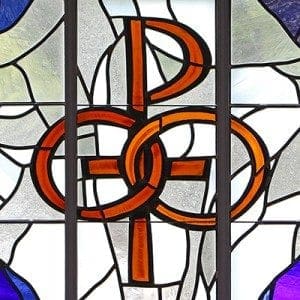 A pair of wedding bands symbolizing the sacrament of marriage is depicted in a stained-glass window at St. Patrick Church in Smithtown, N.Y. Pope Francis' postsynodal apostolic exhortation on the family, "Amoris Laetitia" ("The Joy of Love"), was released April 8. CNS photo/Gregory A. Shemitz 