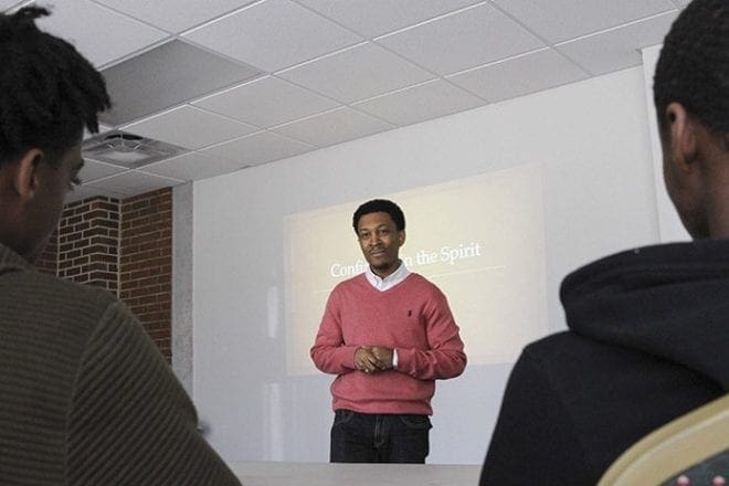 Lyndon Batiste, standing, the high school youth minister at Blessed Sacrament Church, Atlanta, was the workshop speaker for the youth track during the April 9 sequel to Faith In Action, the brainstorming session that originally took place last September within the archdiocese’s black Catholic community. Batiste’s workshop entitled “Confirmed In the Spirit” focused on turning youth from spectators to participators in the faith. Photo By Michael Alexander