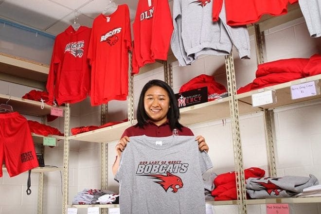 Jenn Nguyen, a senior at Our Lady of Mercy High School, Fayetteville, embraced the school’s academic rigor, it’s diverse student body and spiritual dimension. Nguyen once spearheaded a shoe drive at the school, which garnered 800 shoes in a week’s time for adults and children in Guatemala. Photo By Michael Alexander