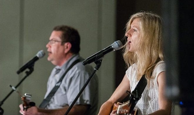 Greg Ferrara, left, and Geneva Tigue, local musicians from south of Atlanta, lead worship for the REVIVE track at the 2016 Eucharistic Congress. Photo By Thomas Spink