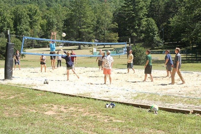 After lunch some of the youth ministers take to Covecrest’s sand-filled volleyball court, where they have some fun before the afternoon workshop session begins. Photo By Michael Alexander