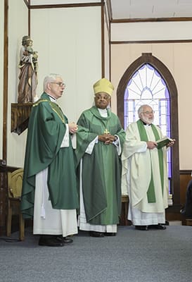 (L-r) Father Thomas Shuler, pastor of Our Lady of the Mount Church, Lookout Mountain, and administrator of St. Katharine Drexel Mission, Trenton, expresses his thanks to Archbishop Wilton D. Gregory, Msgr. Leo Herbert, the former pastor and original administrator, and the congregation. Photo By Michael Alexander
