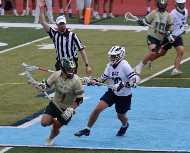 Wilson Van Buren, a Blessed Trinity junior midfielder, protects the ball in the lacrosse state championship game. He had one goal and two assists in the game.