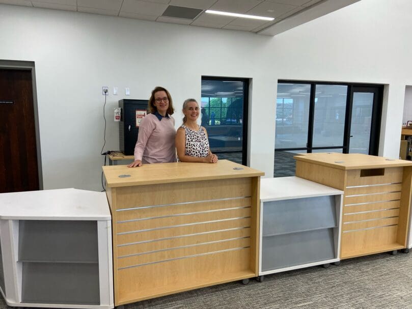 Library staff at St. Pius X High School welcome students to new library.