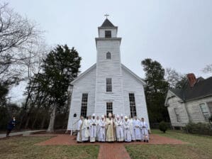 Six bishops and other clergy members gather for a photo at the Church of the Purification following the 200th anniversary Mass.